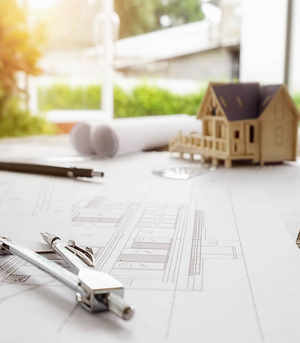 Architectural drawing and model of a house.